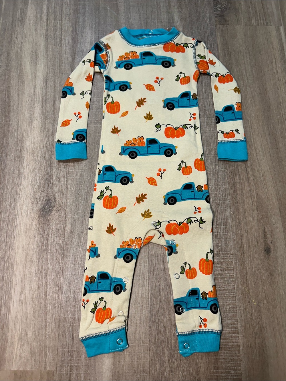 Lazy One Cream One-Piece with Blue Trucks & Orange Pumpkins